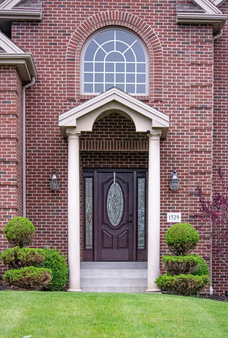 House entry with a brown front door