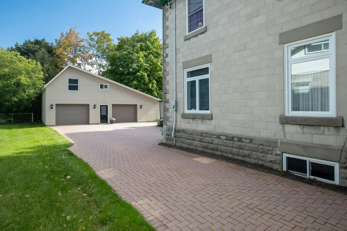 House exterior and paved driveway